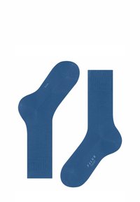 Blaue Baumwollsocken mit geripptem Bündchen, glatter Textur, nahtlosem Zehenbereich und subtilem Branding an der Sohle. Zwei Socken nebeneinander präsentiert.