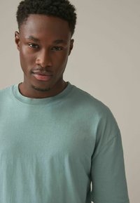 Next RELAXED FIT zielony