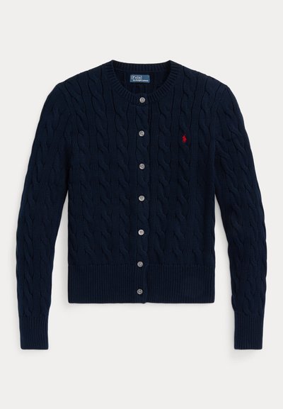 Navy blue cable-knit cardigan with a round neckline, six button closure, and ribbed hem and cuffs. Small red logo accent on the left chest.