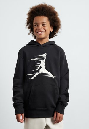 Felpa nera con cappuccio che presenta un grande logo Jumpman bianco sfocato. Ha una tasca frontale e una vestibilità comoda, realizzata in tessuto morbido.