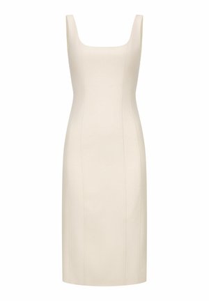 Mouwloze beige nauwsluitende jurk tot op de knie met een vierkante halslijn en verticale naaddetails.