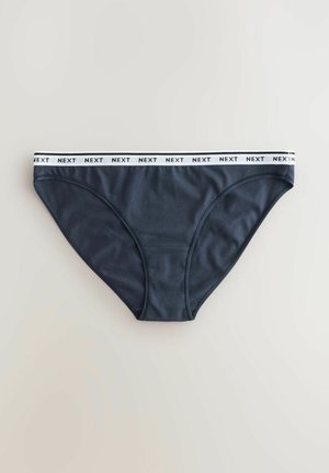 Culotte de bikini en coton bleu marine foncé avec une ceinture élastique blanche portant le texte "NEXT." Texture lisse et design classique couvrant.