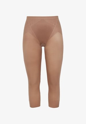 Leggings gainants beige, longueur mi-mollet, avec une texture lisse, un design sans coutures et un motif géométrique subtil sur la ceinture.