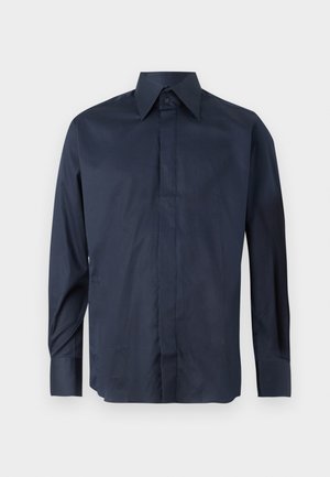Navy blue long-sleeve shirt with a pointed collar, made of smooth fabric. Features button closure and cuffs, no visible patterns or graphics.