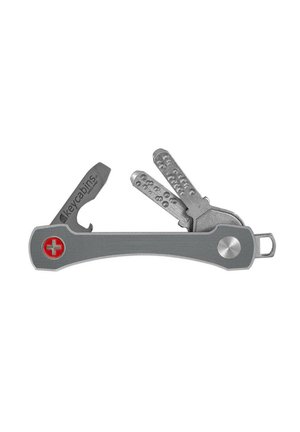 Compact gray key organizer holding two dimple keys and a small flat tool with a red Swiss cross logo.