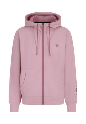Rosa Zip-Hoodie aus weichem Stoff, mit großer Kapuze, Fronttaschen und einem Logo auf der Brust sowie Text auf einem Ärmel.