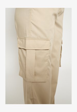 Beežid töörõivapüksid, millel on sile tekstuur, külgmise plaastri tasku ja sirge säärekujundusega. Valmistatud kergest kangast.