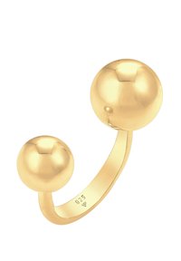 Guld ring med en öppen design och två distinkta sfäriska accenter av olika storlekar. Materialet är stämplat med "925" för sterlingsilver.