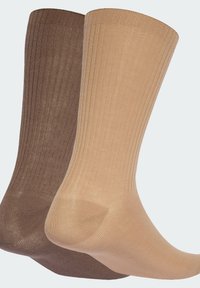 Two pairs of knee-high socks in light beige and dark brown, featuring ribbed texture, soft fabric, and reinforced toe and heel areas.
