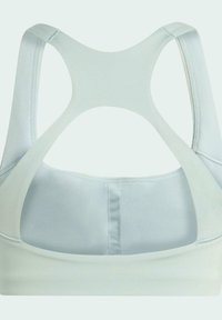 Lichtblauwe sportbeha met een racerback-ontwerp, gemaakt van zachte, rekbare stof. Gladde textuur en minimale naden voor comfort.