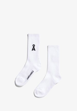 Calzini bianchi di cotone con texture a coste, caratterizzati da un simbolo logo nero e il nome del marchio "ARKEDANGELS" stampato sul lato.