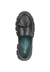 Mocassin en cuir noir avec des glands latéraux, semelle intérieure rembourrée et semelle épaisse texturée. L'intérieur présente un branding teal contrastant.