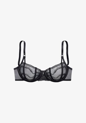 Soutien-gorge noir en dentelle avec armatures, doté de bonnets en mesh transparent, de bords festonnés et d'un ornement décoratif au centre devant. Bretelles réglables.