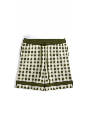 Shorts à carreaux verts et blancs avec une ceinture élastique, un cordon de serrage et un ourlet plié. Fabriqués en tissu doux avec une coupe décontractée.
