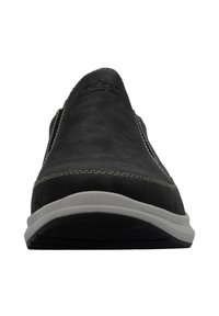 Black leather slip-on shoe with gray sole, features contrasting white stitching and logo on the vamp. Flat and rounded toe design.