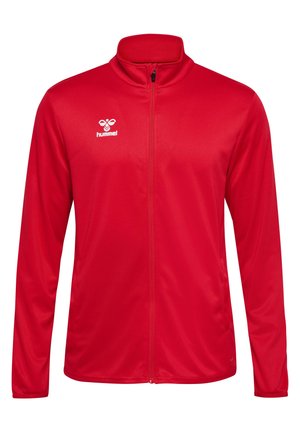 Veste zippée rouge en matériau lisse, dotée d'un col montant et d'un logo blanc sur la poitrine gauche. Manches longues avec un ourlet droit.