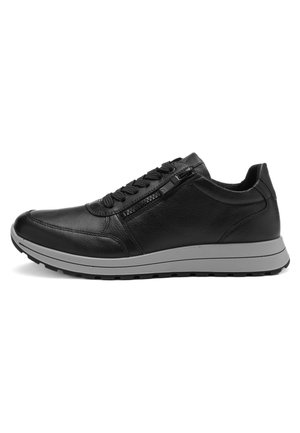 Black leather sneaker with lace-up front and side zipper, gray rubber sole, and textured outsole for traction, shown in profile view.