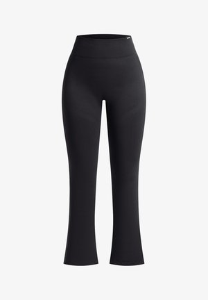 Zwarte legging met een hoge tailleband, gemaakt van rekbare, gladde stof. Heeft uitlopende pijpen en subtiele textuurpatronen langs de zijkanten.