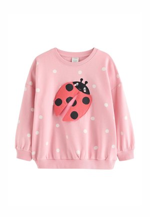 Różowa dziecięca bluza z długim rękawem w białe kropki z trójwymiarowym wzorem biedronki z ruchomymi skrzydełkami na przodzie.