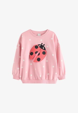 Lyserød børnesweatshirt med lange ærmer og hvide polkaprikker samt et 3D-design af en mariehøne foran med bevægelige vinger.