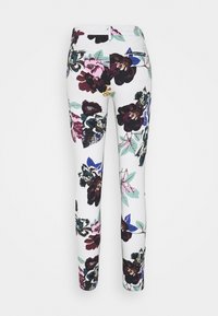 Blommiga leggings med vit bakgrund, stora mörka blommönster i burgundy, grön och blå, smal passform och slät textur.