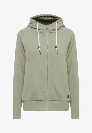 Lys grøn zip-up hettegenser med hette, hvite snorer, treperle detaljer og et mønstret indre fôr. Myk, teksturert stoff.