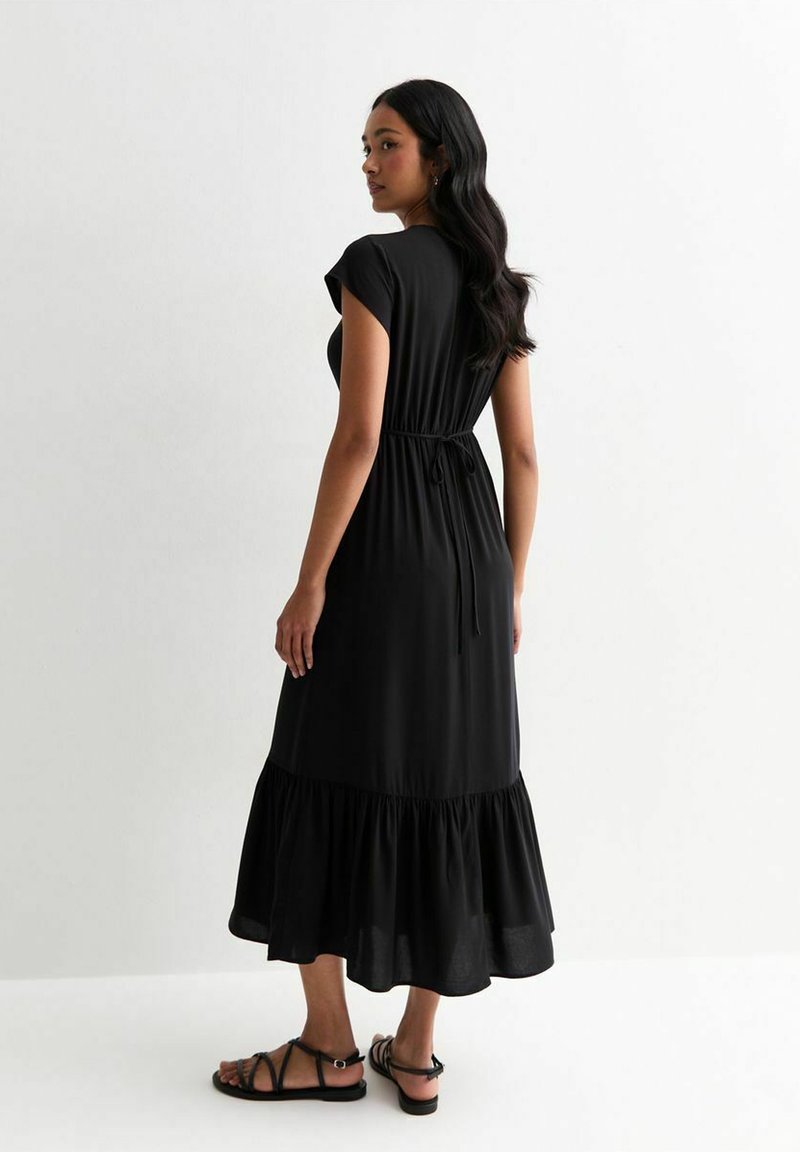 black dress from breakfast at tiffany's Black Cotton Tulle Ruffle Hem Shift Dress main image 1