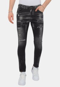 Local Fanatic PAINT SPLATTER DESTROY STOASH - Jeans Skinny Fit - zwart