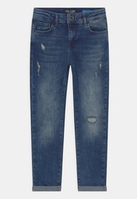 Dark blue denim jeans with a tapered fit, featuring distressed areas, a button closure, and rolled cuffs at the hem.