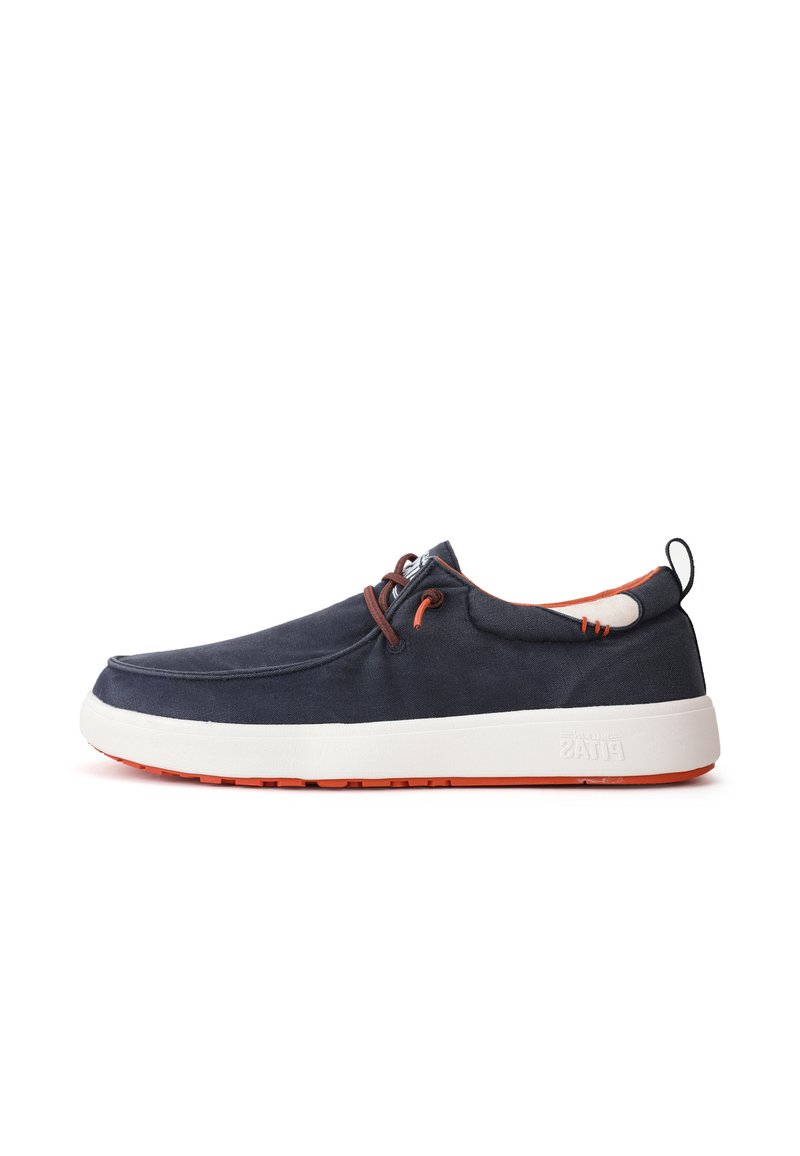 Navy blue canvas shoe with a white midsole and orange outsole. Features brown laces and stitching details. Round toe with a slip-on design.