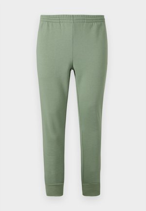 Pantalon de jogging vert clair en tissu doux, avec une taille élastique, des jambes effilées et des poignets côtelés aux chevilles.