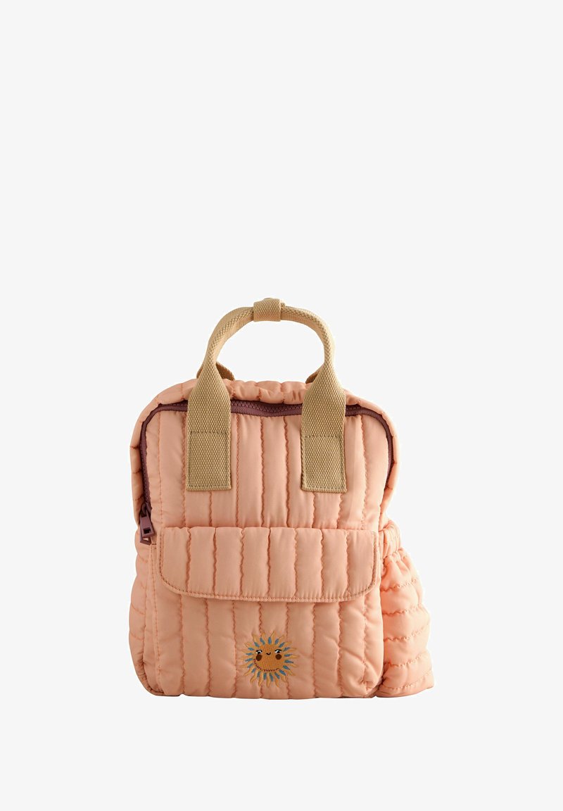 Small quilted peach backpack with beige handles, front pocket, side pocket, and a smiling sun embroidered on the front.
