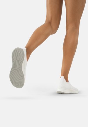 White slip-on shoes with a textured knit upper and rubber sole, showcasing a flexible design and lightweight construction.