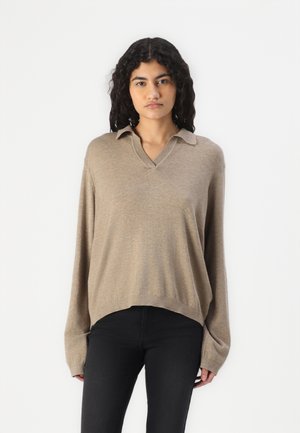 Beige knit pullover sweater with a V-neck, long sleeves, and a relaxed fit. Features a folded collar and ribbed hem detail.