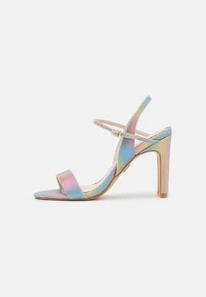 High-heeled sandal featuring a multi-colored iridescent fabric, open-toe design, thin ankle strap, and a solid block heel.