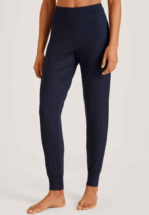 Pantalons de fitness navy en tissu extensible, avec une taille haute, des jambes fuselées et des poignets ajustés aux chevilles.