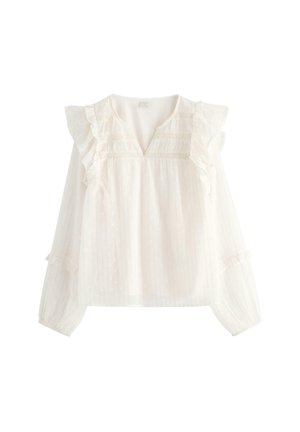 Hvid langærmet skjorte med rynkede skuldre, V-udskæring, diskrete lodrette striber og delikat prikket tekstur.