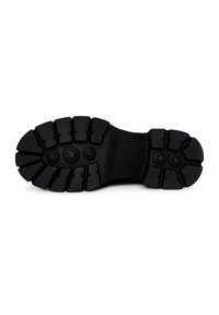 Semelle en caoutchouc noir avec des rainures profondes, présentant six motifs de grip circulaires et une section médiane solide. Conçue pour l'adhérence et la stabilité.