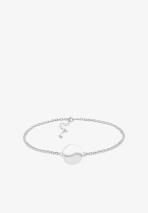 Pulsera de plata con un colgante redondo de yin-yang en una cadena delicada y un cierre ajustable con la etiqueta "S925" para plata de ley.