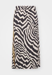 Tropical print sukně s černo-krémovým zebrovým vzorem, má elastický pas a boční ozdobu z látky v zlatém tónu.