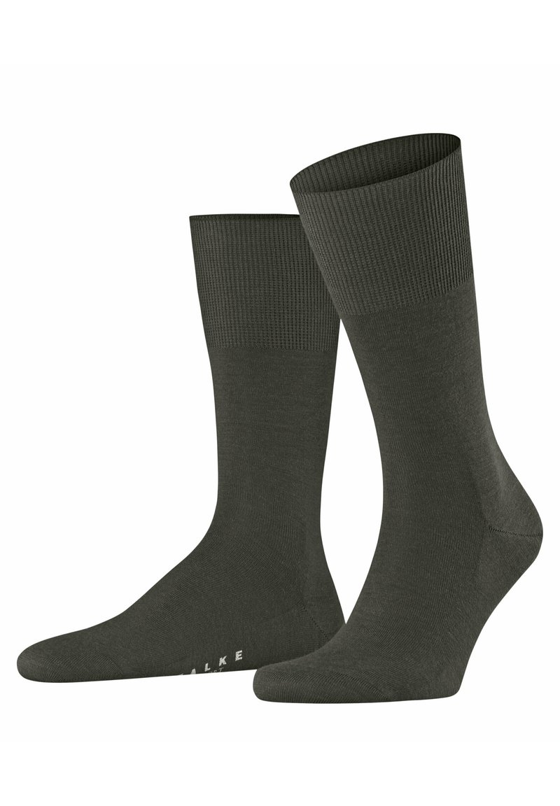Calcetines de tripulación de color verde oscuro, hechos de un material suave, con un puño acanalado y un diseño de punta sin costuras. Marca sutil en la suela.