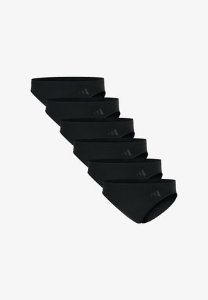 Cinque slip da uomo neri con un logo del marchio sottile disposti in una fila diagonale su uno sfondo bianco.