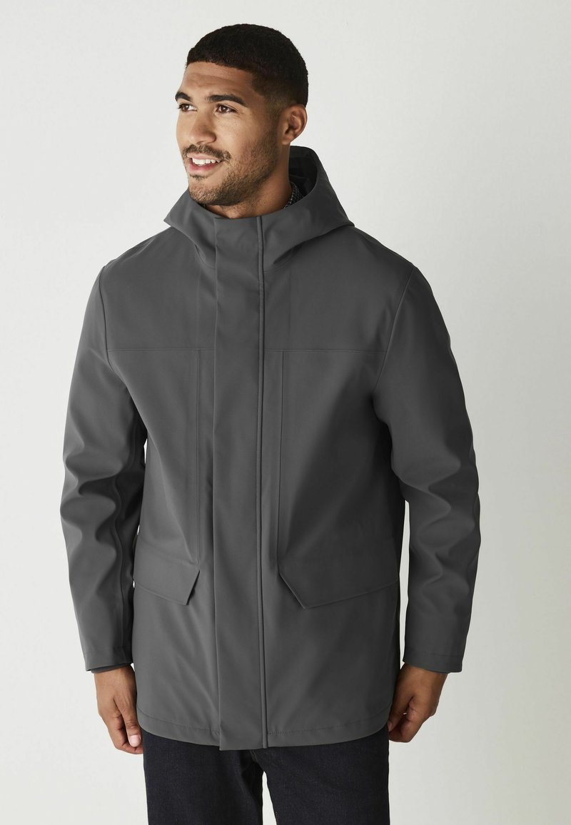 Gray waterproof jacket with a hood, featuring two front pockets, a straight cut, and smooth texture. No visible fasteners or patterns.