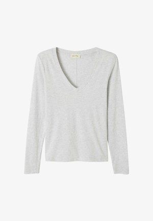 Vaalea harmaa pitkähihainen paita, jossa on V-pääntie. Valmistettu pehmeästä kankaasta, jossa on rento istuvuus ja vähäiset ompeluyksityiskohdat.