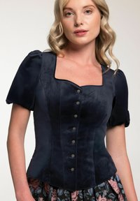 Navyblaues Samt-Corsett-Top mit Puffärmeln, quadratischem Ausschnitt und dekorativen Knöpfen auf der Vorderseite. Glatte Textur und strukturiertes Design.