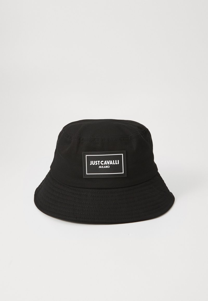 Black bucket hat made of fabric with a wide, round brim. Features a rectangular logo patch with white text on the front.