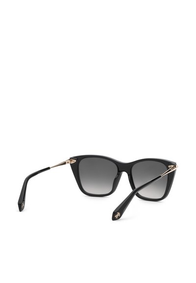 Lunettes de soleil œil de chat noires avec verres gris dégradés et accents dorés sur les branches, reposant ouvertes sur une surface blanche.