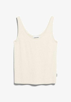 Débardeur crème sans manches à encolure dégagée, avec étiquette en tissu cousue dans l'encolure et la couture latérale.