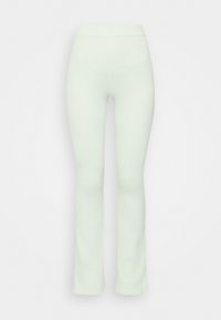 Leggings verde menta com efeito canelado e bainha larga, apresentando uma faixa elástica larga na cintura e um acabamento suave e texturizado.