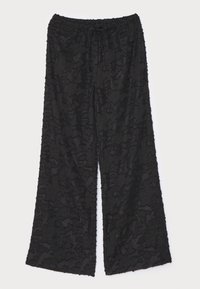 Pantalons larges noirs en tissu texturé, avec un motif floral, une taille élastique et une fermeture à cordon.